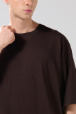 Camiseta oversize manga corta unicolor con diseño posterior