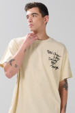 Camiseta manga corta oversize unicolor con textos estampados