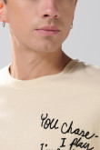 Camiseta manga corta oversize unicolor con textos estampados