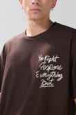 Camiseta manga corta oversize unicolor con textos estampados