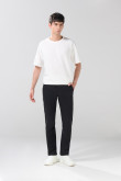 Pantalón tiro medio unicolor slim en dril con bolsillos