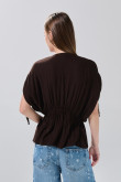 Blusa unicolor con elástico en cintura y manga larga
