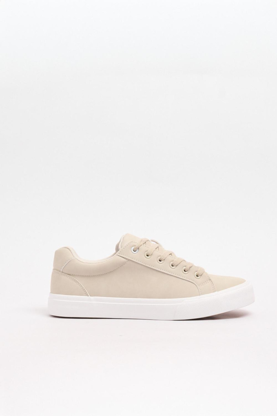 Tenis unicolores casuales con suelas en contraste planas