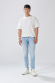 Jean skinny tiro bajo azul con desgastes y cremallera
