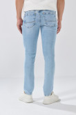 Jean skinny tiro bajo azul con desgastes y cremallera