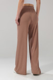 Pantalón flare unicolor en tela acanalada con bota ancha