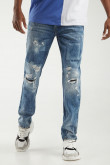 Jean skinny azul medio con rotos, parches y detalles en láser